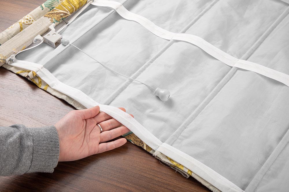 Learn how to sew your own lift cord tape for roman shades in this video tutorial.